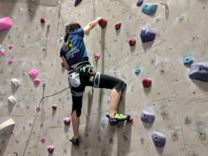 Ha climbing a lead wall